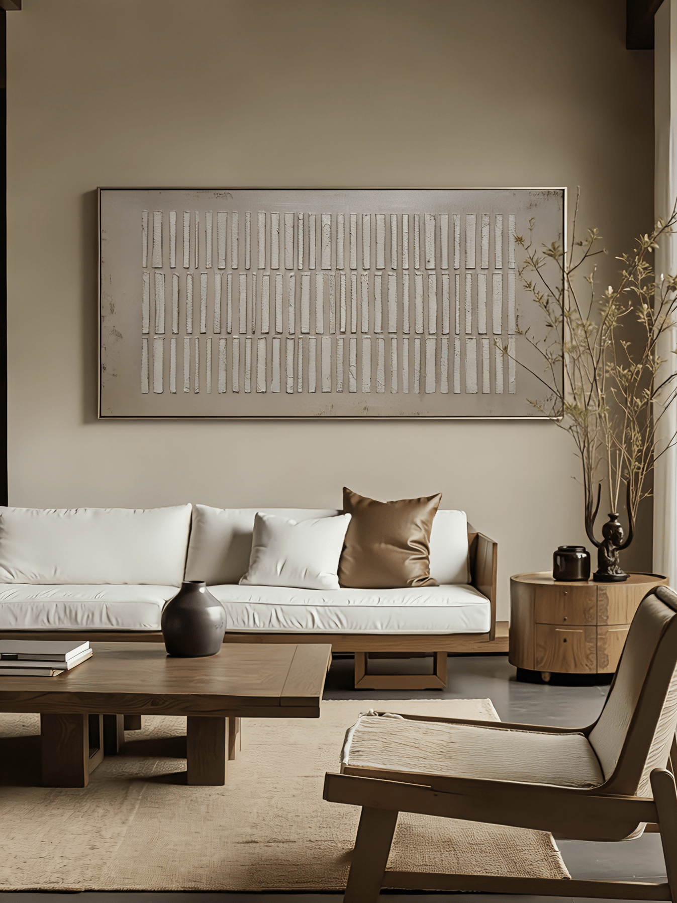 A large horizontal modern 3D relief painting by Eliot Vermeer featuring repeating vertical textured bars in white over a warm taupe background, hung above a minimalist sofa.