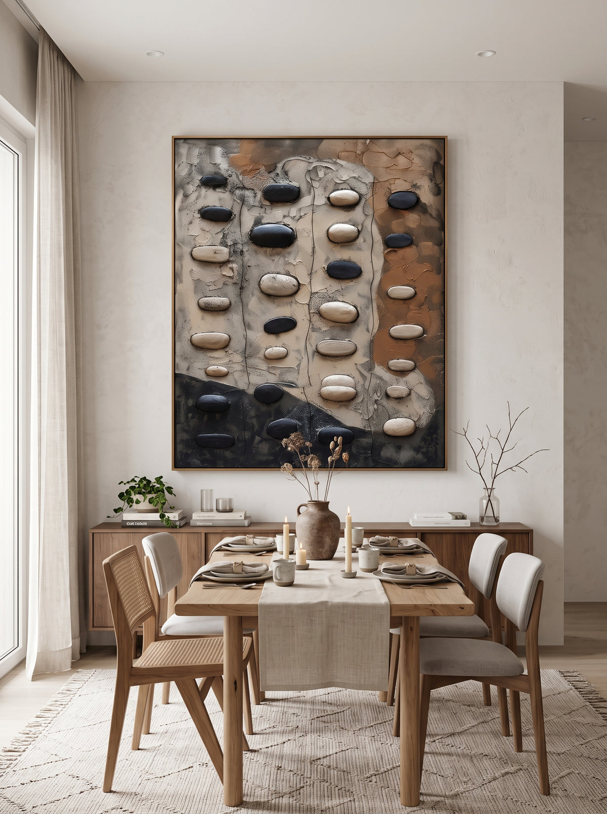 Framed vertical textured plaster stone wall art mounted in modern dining room with natural wood accents