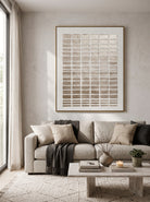 Vertical modern metallic gold 3D rectangular relief canvas art displayed next to sofa in minimalist living room