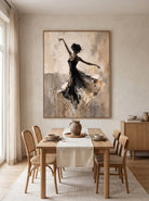 Hand-painted abstract ballet dancer painting displayed in a contemporary open dining room with neutral decor.