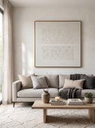 Square monochrome cream textured geometric canvas wall art hanging above sofa in modern wabi-sabi living room