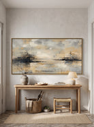 Warm ivory and golden yellow water reflection canvas painting mounted above minimalist console table in entryway