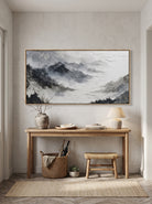 Textured horizontal alpine landscape canvas painting above modern console table in entryway