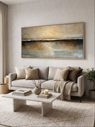 Large horizontal earth-tone abstract landscape painting above contemporary sofa in wabi-sabi living room