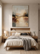 Calming golden mist water reflection canvas artwork hanging above a minimalist Japandi bedroom headboard