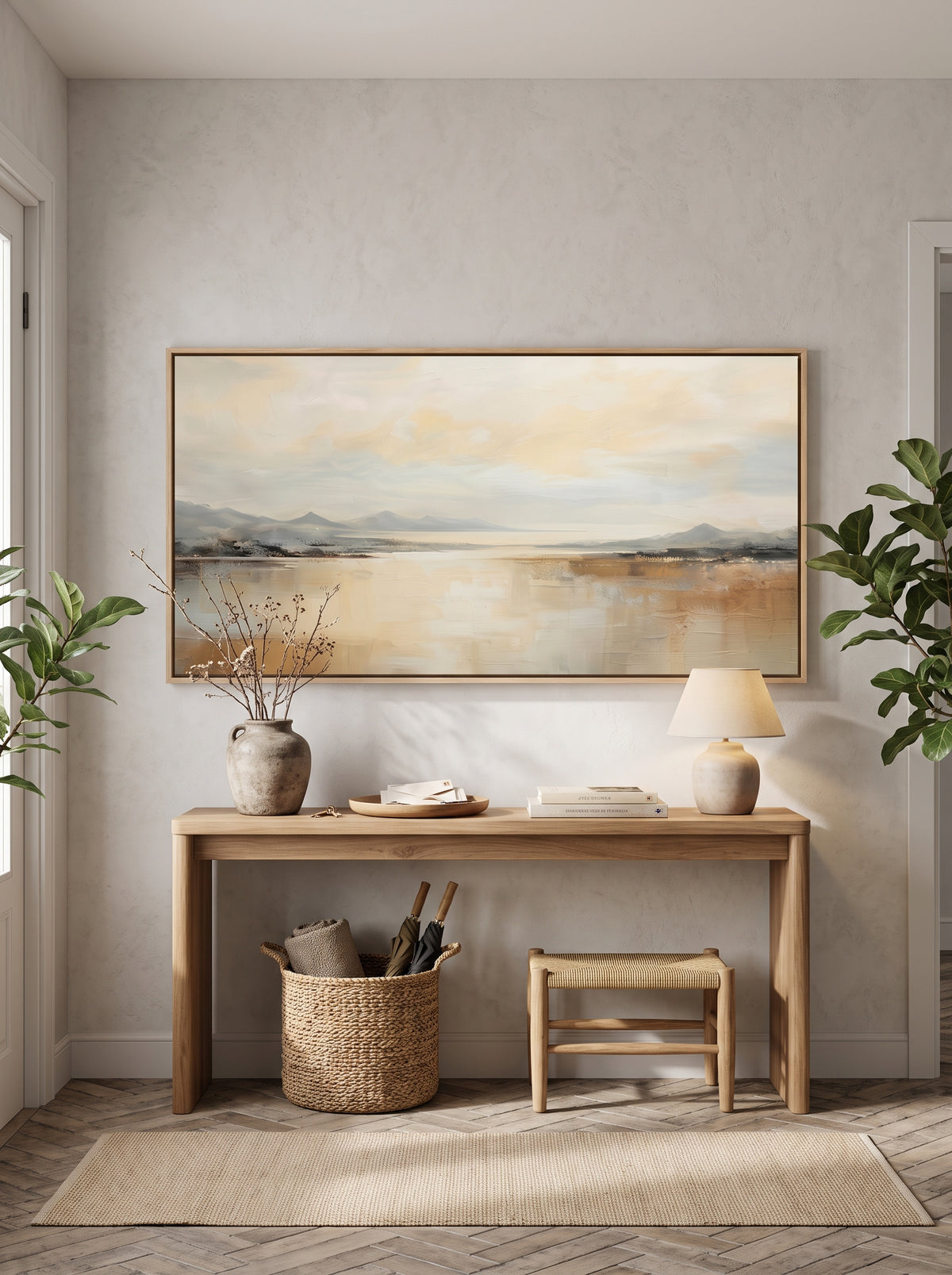 Framed panoramic coastal horizon canvas painting above console table in bright minimalist entryway