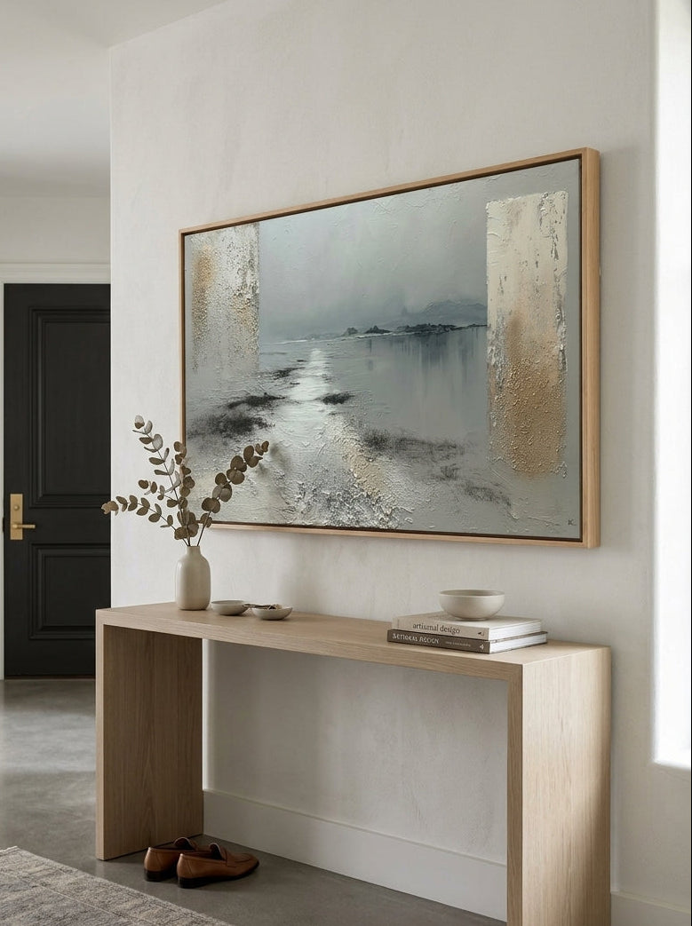 Panoramic organic modern textured painting in natural wood floating frame placed above an entryway console