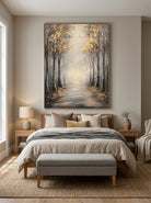Serene misty autumn tree path canvas artwork hanging above a contemporary Japandi bedroom headboard