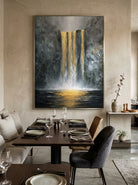 Oversized vertical golden water cascade canvas art displayed on an open-concept dining room accent wall