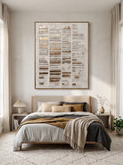 Tactile white plaster and antique gold wall art by Eliot Vermeer hanging in tranquil contemporary bedroom