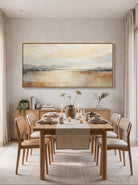Textured horizontal earth-tone landscape artwork displayed in contemporary neutral dining room