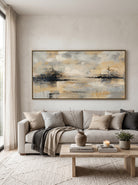 Large panoramic warm gold and grey lake reflection canvas wall art above modern sofa in minimalist living room