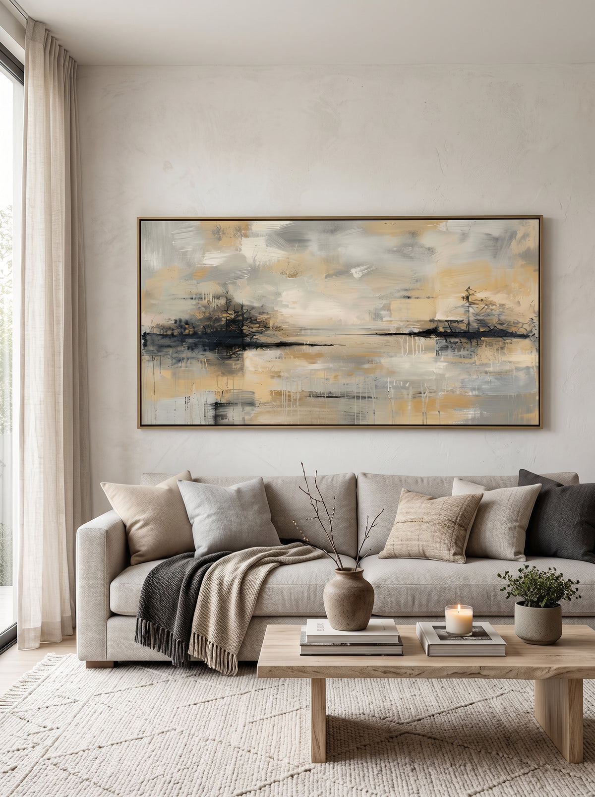 Large panoramic warm gold and grey lake reflection canvas wall art above modern sofa in minimalist living room