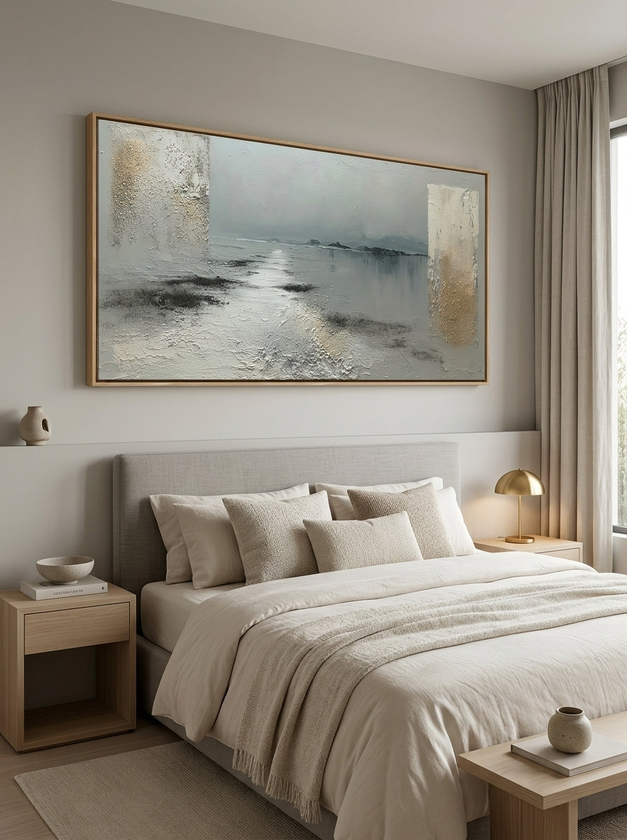 Minimalist calm lakeview oil painting hanging over a Japandi style wooden bedroom headboard