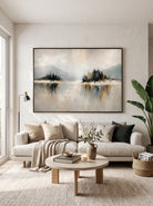 Large horizontal wabi-sabi lake reflection canvas wall art above modern neutral sofa in minimalist living room