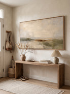 Textured Wabi-Sabi landscape painting in beige and muted olive tones displayed in a modern entryway.