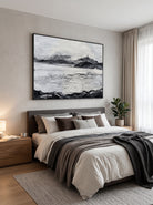 Monochrome heavy texture snow mountain and lake canvas artwork hanging above a Japandi bedroom headboard