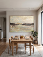 Large horizontal textured impressionist waterscape canvas art displayed on an open-concept dining room wall