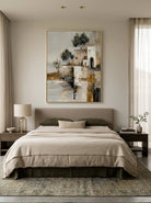 Rustic coastal village canvas artwork hanging in a peaceful earth tone master bedroom interior