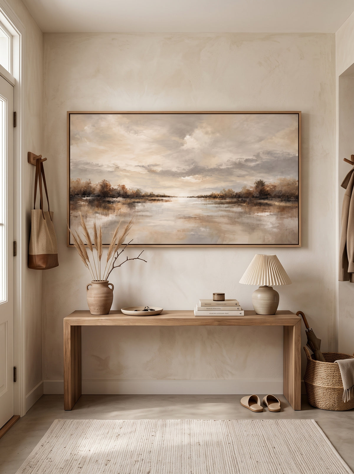 Warm beige and russet water reflection canvas painting mounted above minimalist console table in entryway