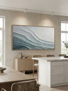 Modern minimalist wave canvas wall art featured on a dining wall near an open kitchen interior