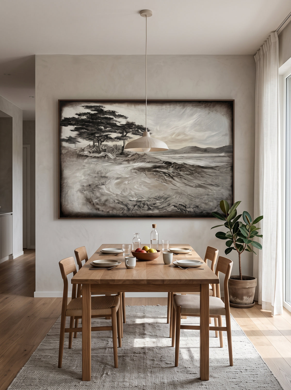Large horizontal grey and black textured landscape wall art displayed on an open-concept dining room wall