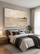 Calming earth tone desert plain canvas artwork hanging above a contemporary Japandi wooden bedroom headboard