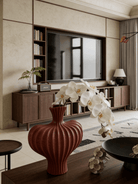 sculptural fluted ceramic vases in black, cream, and terracotta rust, organic heart-shaped silhouette, artistic home decor.