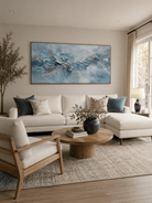 Large hand-painted blue textured abstract ocean wave wall art on panoramic canvas for modern living room decor