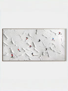 Close-up of large 3D textured painting by Lucien Hoffmann featuring tiny colorful skiers on a heavy white impasto snow mountain canvas.