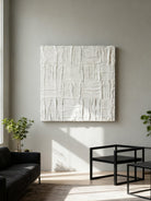 Plaster texture wall art displayed in contemporary living room interior