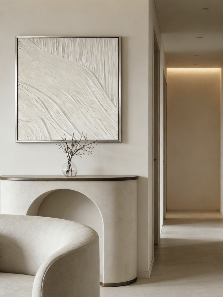 Close-up of the hand-painted white textured wall art featuring heavy impasto flowing lines in a silver floater frame