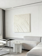Textured plaster wall art displayed in contemporary living room, showcasing abstract canvas in modern home interior