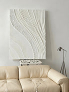Textured plaster wall art displayed in contemporary living room, showcasing dimensional abstract painting