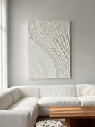 Textured plaster wall art displayed in contemporary living room, showcasing dimensional abstract painting