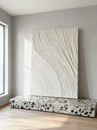 Textured plaster wall art displayed in contemporary living room, showcasing dimensional abstract painting