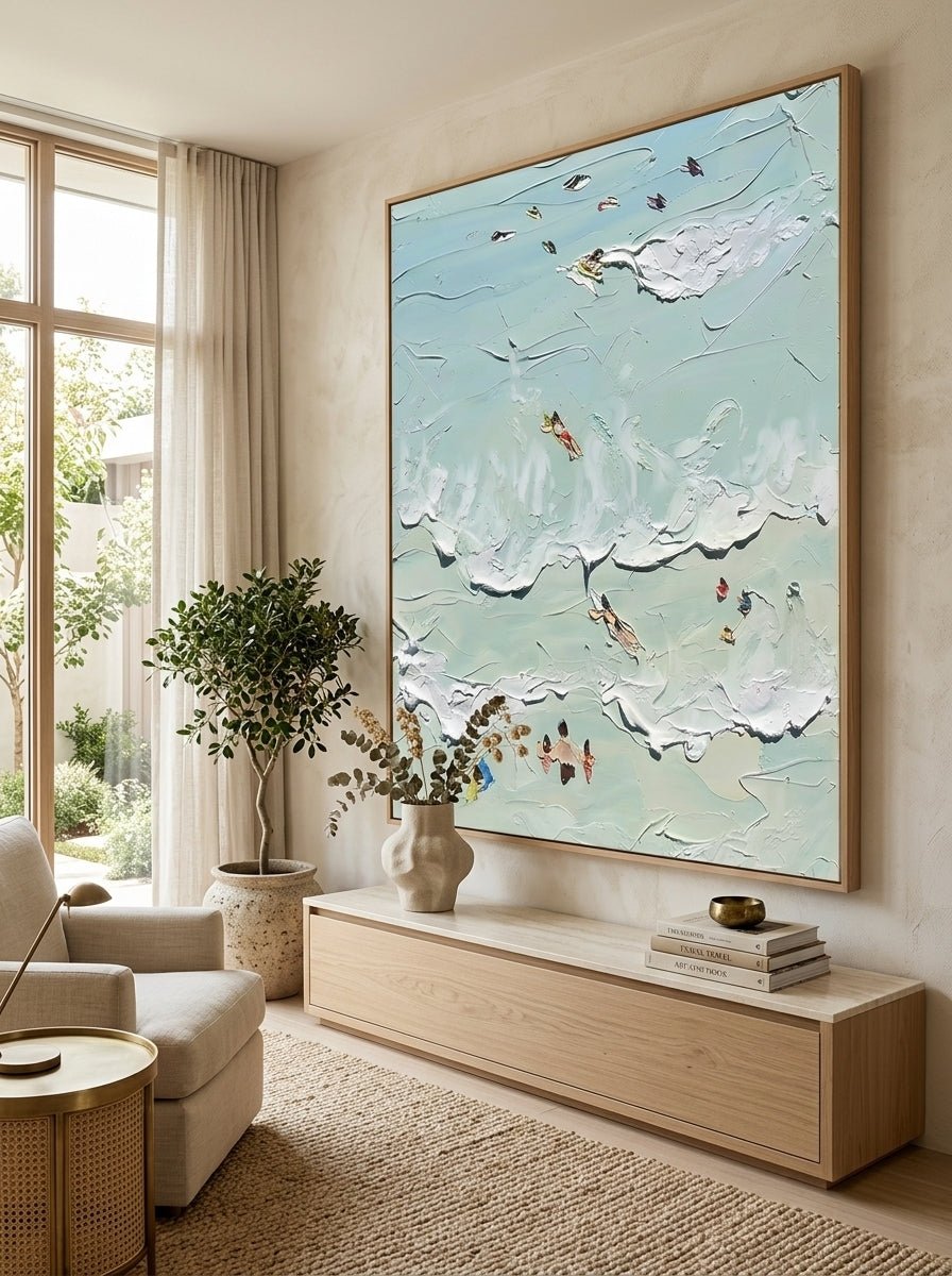 Hand-painted textured coastal surf wave wall art featuring ocean waves and surfers in soft aqua tones on canvas