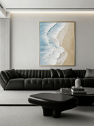 Large vertical 3D textured ocean wave painting featuring white impasto foam and turquoise water on a sandy beach background.
