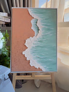 Hand-painted 3D textured beach painting with thick white seafoam ridges and turquoise water in a gold floater frame.