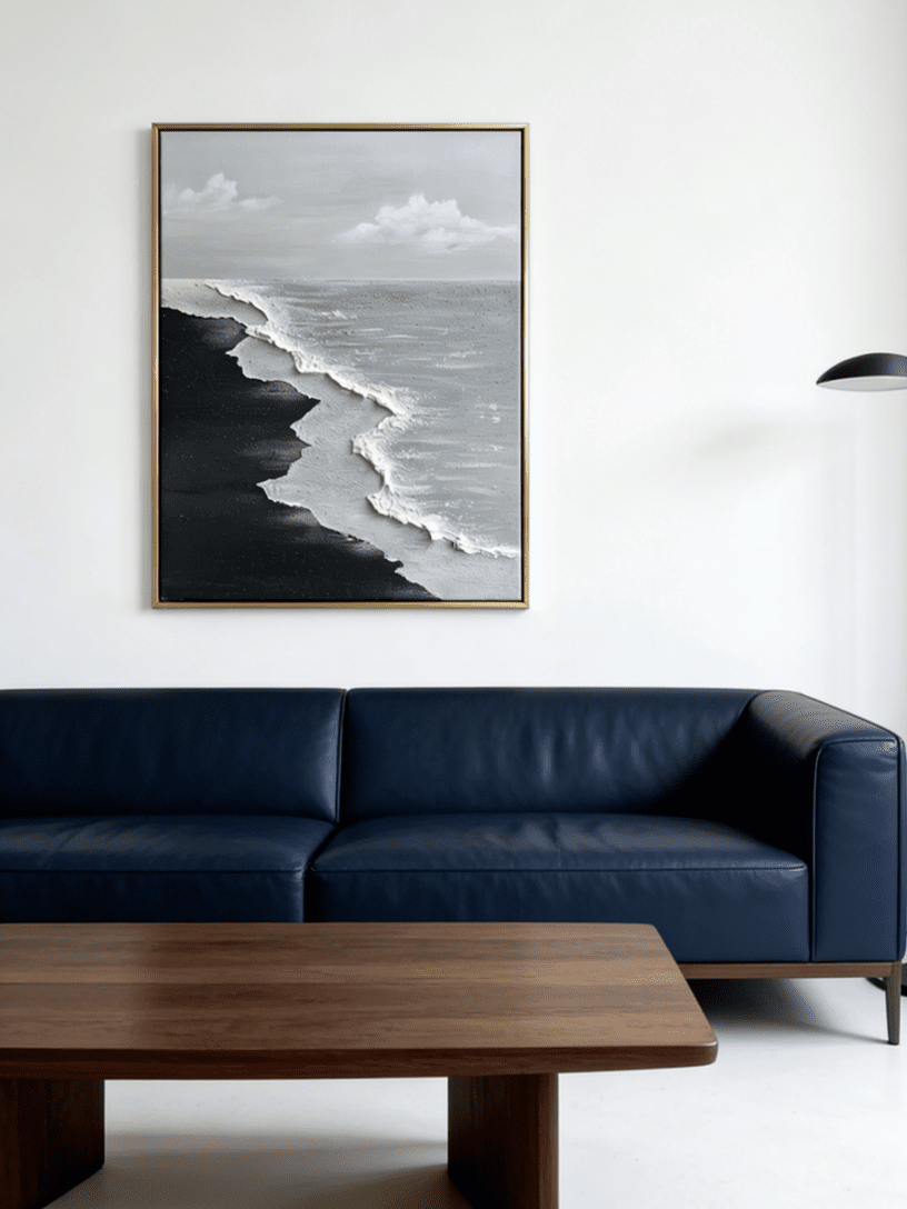 Close-up of a hand-painted 3D textured black sand beach painting with heavy white sculpted seafoam and black waves in a black frame.
