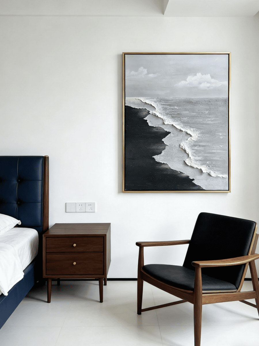 Close-up of a hand-painted 3D textured black sand beach painting with heavy white sculpted seafoam and black waves in a black frame.