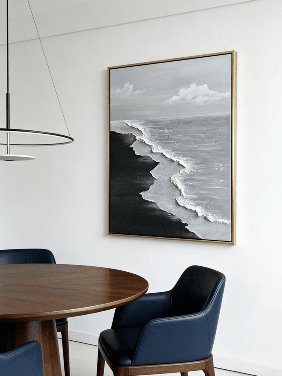 Close-up of a hand-painted 3D textured black sand beach painting with heavy white sculpted seafoam and black waves in a black frame.