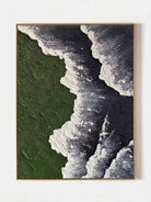Close-up of a hand-painted 3D textured abstract painting featuring heavy white sculpted foam over moss green and black backgrounds in a gold frame.