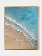 Hand-painted 3D textured beach painting with thick white sculpted seafoam ridges and deep blue water in a gold floater frame.