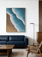 Close-up of 3D hand-painted ocean waves featuring heavy white sculpted foam over turquoise blue water and brown sand texture.