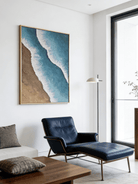 Close-up of 3D hand-painted ocean waves featuring heavy white sculpted foam over turquoise blue water and brown sand texture.