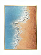 Hand-painted 3D textured aerial view of beach waves with heavy white sculpted foam and granular golden sand texture in a gold frame.