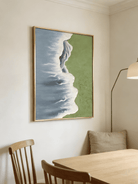 Side view of 3D hand-painted textured painting showing thick white seafoam between moss green meadow and slate blue ocean.