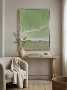 Close-up of 3D hand-painted textured ocean waves in sage green and olive, showing thick white sculpted seafoam ridges on canvas.