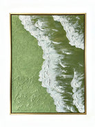High-relief 3D textured painting showing white sculpted seafoam splashing over a deep forest green background in a gold frame.